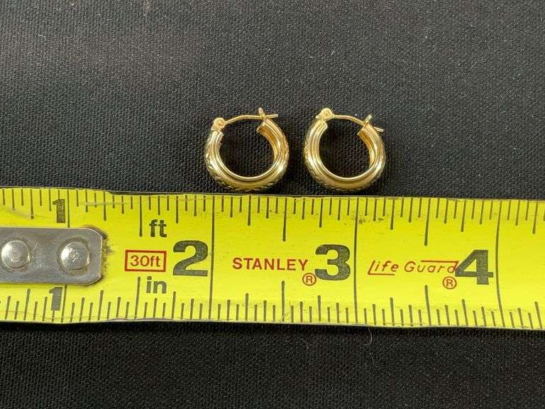 14k yellow gold hoop earrings tested and weighs 1 grams