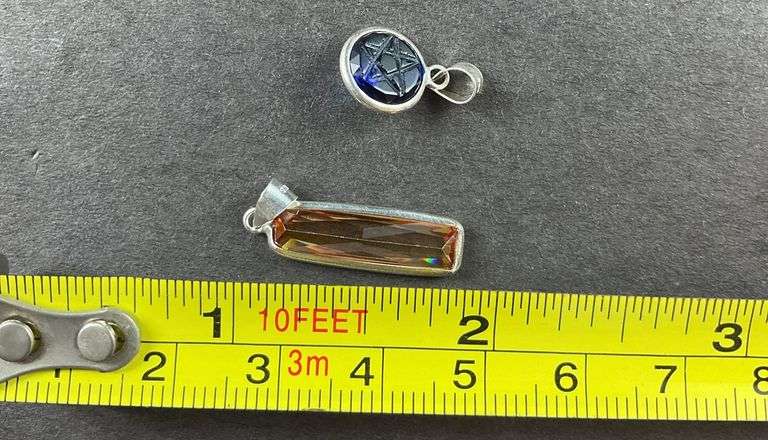 Two sterling silver pendants