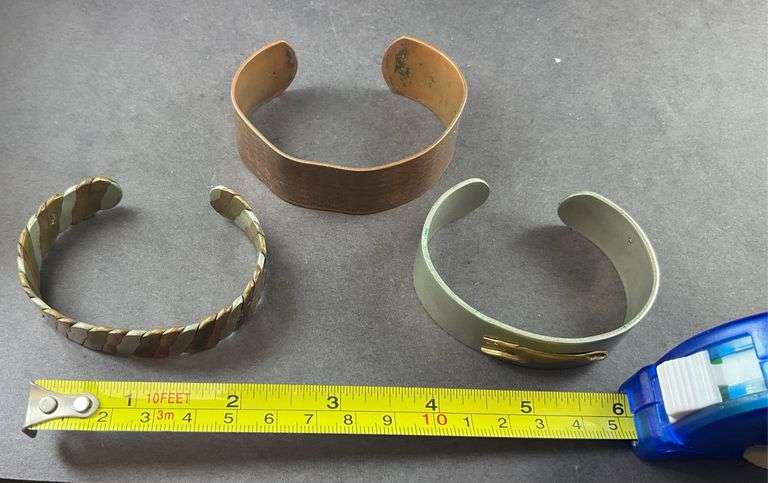 Three Cuff Bracelets One of Copper, One Copper And Silvertone, One Heavy Silver Tone