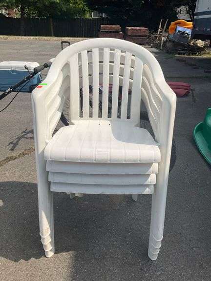 Four Stackable Plastic Patio Chairs