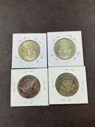 Four Kennedy half dollars 1964(2), 2005, and 1980