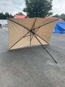 Beige Patio Umbrella Missing Top, 9’L x 6’W
