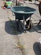 Green Polyethylene Wheelbarrow With Metal Frame and Dual Wheels