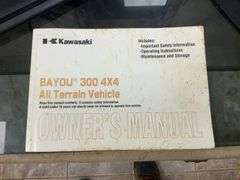 Kawasaki Bayou 300 4-Wheeler, 4x4. Front 4 foot blade and winch.