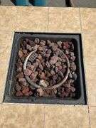Propane Firepit with Lava Rocks and Woven Cabinet Design