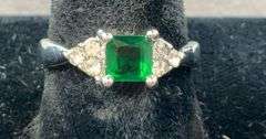Green and white CZ plated ring size 6