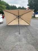 Beige Patio Umbrella Missing Top, 9’L x 6’W