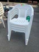 Four White Plastic Stackable Patio Chairs