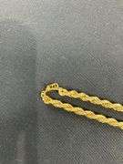 Monet goldtone chain 20in, pair of clip on earrings, and floral pins
