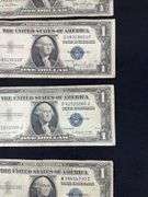 Four silver certificates all 1935 with series D(2), G, and F