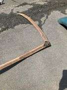 Two-Handed Scythe With Curved Wooden Handle and Metal Blade