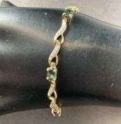 Gold Tone Silver Bracelet With Sapphires Made In China 7.9 grams Sterling Silver size 7.5"