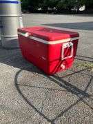 Red Igloo Cooler with Hinged Lid and Side Handles