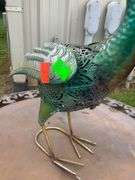 Decorative Metal Bird Sculpture, Foldable Patio Table, and Folding Chair