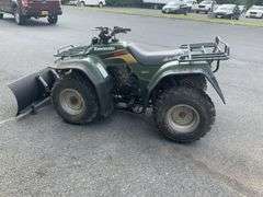 Kawasaki Bayou 300 4-Wheeler, 4x4. Front 4 foot blade and winch.