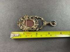 Cameo, champagne, and white aurora borealis Austrian crystal goldtone brooch / pendant