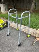 Gray Metal Mobility Walker with Two Wheels and Tennis Ball Feet