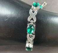 Green CZ silvertone X&O bracelet 7-8in