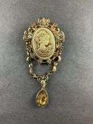 Cameo, champagne, and white aurora borealis Austrian crystal goldtone brooch / pendant