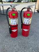 Two Red Fire Extinguishers with Instruction Labels