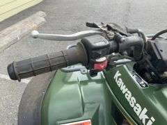 Kawasaki Bayou 300 4-Wheeler, 4x4. Front 4 foot blade and winch.