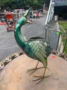 Decorative Metal Bird Sculpture, Foldable Patio Table, and Folding Chair