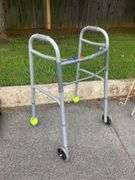 Gray Metal Mobility Walker with Two Wheels and Tennis Ball Feet
