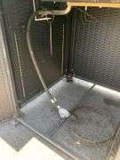 Propane Firepit with Lava Rocks and Woven Cabinet Design