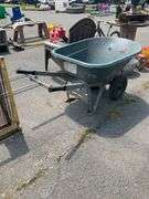 Green Polyethylene Wheelbarrow With Metal Frame and Dual Wheels