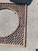 Iron Grate with Center Opening and Geometric Pattern