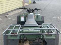 Kawasaki Bayou 300 4-Wheeler, 4x4. Front 4 foot blade and winch.