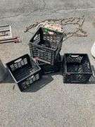 Four Black Plastic Crates With Cracked Features