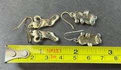 Two Sets Of Christmas Earrings One Is A Red Stocking With Packages, Penguins With Santa Hats Not Magnetic