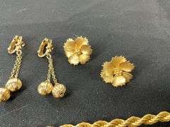 Monet goldtone chain 20in, pair of clip on earrings, and floral pins