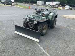 Kawasaki Bayou 300 4-Wheeler, 4x4. Front 4 foot blade and winch.