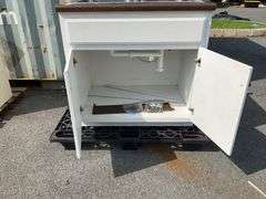 White Cabinet With Dual Stainless Steel Sink and Brown Countertop