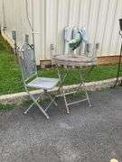 Decorative Metal Bird Sculpture, Foldable Patio Table, and Folding Chair