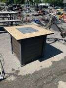 Propane Firepit with Lava Rocks and Woven Cabinet Design