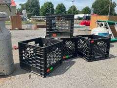 Four Black Plastic Crates With Cracked Features
