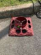 Red Cast Iron Christmas Tree Stand with Decorative Openwork Design