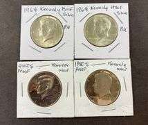Four Kennedy half dollars 1964(2), 2005, and 1980