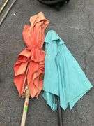 Two Patio Umbrellas With Fabric Damage