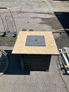 Propane Firepit with Lava Rocks and Woven Cabinet Design
