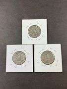 Three silver Washington quarters 1943, 1944D, and 1945