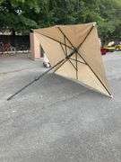 Beige Patio Umbrella Missing Top, 9’L x 6’W