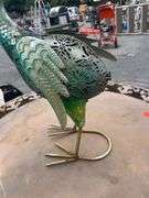 Decorative Metal Bird Sculpture, Foldable Patio Table, and Folding Chair