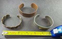 Three Cuff Bracelets One of Copper, One Copper And Silvertone, One Heavy Silver Tone