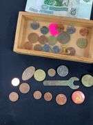 Wooden box with foreign coins and four foreign bills