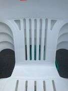 Four White Plastic Stackable Patio Chairs