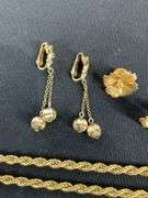 Monet goldtone chain 20in, pair of clip on earrings, and floral pins
